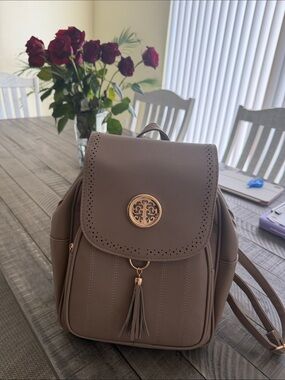 Women's Taupe Faux Leather Backpack with Gold Medallion Accent